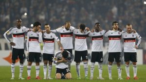 Players of Besiktas react during the penalty shootout upon extra time during their Europa League round of 32 second leg soccer match against liverpool in Istanbul