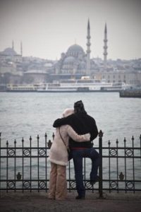 ISTANBUL, TURKEY - FEBRUARY 24:  A couple look over the Bosphorus on February 24, 2012 in Istanbul, Turkey. Though not the capital, Istanbul is the cultural, economic, and financial heart of Turkey with a population of over 13 million people. Situated on the Bosphorus strait, this metropolis, a former capital of the Roman Empire, spans Europe and Asia, the only city in the world to cross two continents. The city is dominated by historical monuments from the Byzantine and Ottoman era, with modern nightclubs, up-market restaurants and boutique hotels helping the city become a tourist hotspot. Istanbul was awarded the status of European Capital of Culture in 2010.  (Photo by Dan Kitwood/Getty Images)